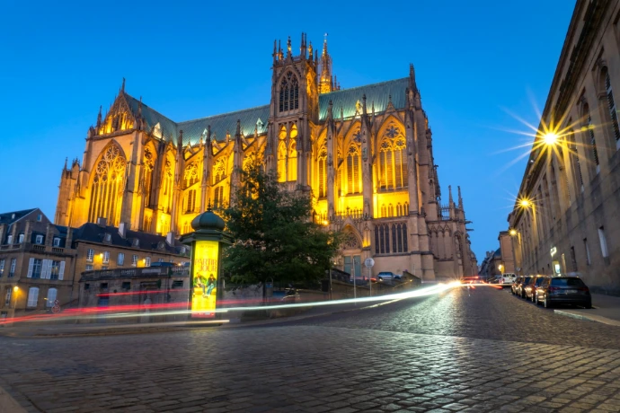 The illuminated cathedral at night in the city.